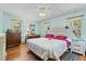 Comfortable bedroom with hardwood floors and two bright windows at 7750 W 5Th Ave, Lakewood, CO 80226