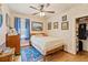 Charming bedroom with floral wallpaper, hardwood floors, and a built-in closet at 7750 W 5Th Ave, Lakewood, CO 80226