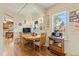 Bright dining area featuring wood floors and natural light, perfect for Gathering meals and gatherings at 7750 W 5Th Ave, Lakewood, CO 80226