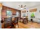 Spacious dining room featuring wood paneling and hardwood floors, ideal for gatherings and Gathering dinners at 7750 W 5Th Ave, Lakewood, CO 80226