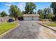 Spacious three-car garage with ample parking space and an extended driveway for additional vehicles at 7750 W 5Th Ave, Lakewood, CO 80226