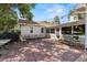 Charming outdoor patio with brick pavers and seating, perfect for entertaining guests and enjoying outdoor relaxation at 7750 W 5Th Ave, Lakewood, CO 80226