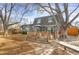 Picturesque backyard with spacious deck, stone walkway, and lush trees offers privacy at 3241 S Krameria St, Denver, CO 80222