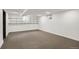 Spacious basement with shelving offers ample storage and potential for customization at 3241 S Krameria St, Denver, CO 80222