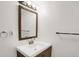 Clean bathroom featuring vanity, a mirror, towel rack, and modern lighting at 3241 S Krameria St, Denver, CO 80222