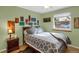 Cozy bedroom with decorative wall art, and soft lighting, creating a relaxing and inviting atmosphere at 3241 S Krameria St, Denver, CO 80222