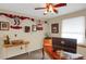 Inviting bedroom with desk, ceiling fan, sports memorabilia, and natural light at 3241 S Krameria St, Denver, CO 80222
