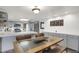 Open concept kitchen with breakfast bar and modern appliances at 3241 S Krameria St, Denver, CO 80222