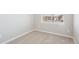 Well-lit bedroom featuring carpet, light walls, a window, and electrical outlets at 9474 Yampa St, Commerce City, CO 80022
