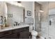 Contemporary bathroom with a glass-enclosed shower and stylish vanity with marble countertop at 5423 S Prince St # B, Littleton, CO 80120