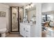 This bathroom features a modern shower with unique tile work, vanity with granite countertop, and sleek fixtures at 5423 S Prince St # B, Littleton, CO 80120