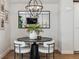 Elegant dining area with a modern chandelier and stylish decor, perfect for gatherings at 5423 S Prince St # B, Littleton, CO 80120