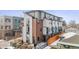 New townhome with modern architecture, brick accents, and well-maintained landscaping at 5423 S Prince St # B, Littleton, CO 80120