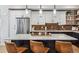 Beautiful kitchen island featuring pendant lights, a white countertop, and room for barstools at 5423 S Prince St # B, Littleton, CO 80120