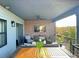This outdoor patio features comfortable seating, a fireplace, and a mounted TV, perfect for relaxation at 5423 S Prince St # B, Littleton, CO 80120
