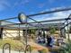 Inviting outdoor patio area with tables, chairs, and shade, perfect for dining and socializing at 5423 S Prince St # B, Littleton, CO 80120