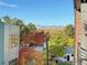 Enjoy this beautiful view of the neighborhood with colorful trees and mountains from the balcony at 5423 S Prince St # B, Littleton, CO 80120