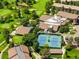 Aerial view highlighting community amenities: tennis courts, pool, golf course, and well-maintained green spaces at 14300 E Marina Dr # 306, Aurora, CO 80014