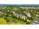 Scenic aerial view of apartments surrounded by lush greenery and mature trees at 14300 E Marina Dr # 306, Aurora, CO 80014