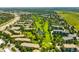 An aerial view of the golf course with mature trees and ponds near luxury apartment buildings at 14300 E Marina Dr # 306, Aurora, CO 80014