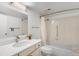 Neutral bathroom featuring white vanity, shower and tub combination, and tile flooring at 14300 E Marina Dr # 306, Aurora, CO 80014