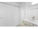 Bright bathroom with a white vanity, quartz countertop, and mirror at 14300 E Marina Dr # 306, Aurora, CO 80014