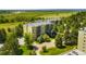 A beautiful apartment building with mature trees and well manicured lawns at 14300 E Marina Dr # 306, Aurora, CO 80014