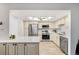Bright kitchen boasts stainless steel appliances, a ceiling fan, and neutral color palette at 14300 E Marina Dr # 306, Aurora, CO 80014