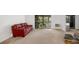 Relaxing living room features bright natural light and comfortable red sofa at 14300 E Marina Dr # 306, Aurora, CO 80014