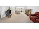 Open living space with comfortable seating and kitchen in the background at 14300 E Marina Dr # 306, Aurora, CO 80014