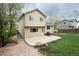 Backyard featuring a two story house, patio, and lush green lawn at 4820 W 125Th Ave, Broomfield, CO 80020