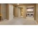 Finished basement area with neutral carpet, white trim, and access to laundry room at 4820 W 125Th Ave, Broomfield, CO 80020