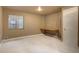 A finished basement, with a small window, built-in desk, and door at 4820 W 125Th Ave, Broomfield, CO 80020