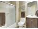 Bathroom featuring a shower with glass doors, white toilet, and modern vanity with a vessel sink at 4820 W 125Th Ave, Broomfield, CO 80020