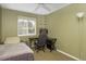 Bedroom featuring neutral carpet and walls, with a bed, desk and shelving at 4820 W 125Th Ave, Broomfield, CO 80020