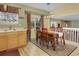 Dining area featuring light wood floors, natural light, and a dark wood table at 4820 W 125Th Ave, Broomfield, CO 80020