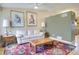 Cozy living room with hardwood floors, a comfortable sofa, and decorative artwork at 4820 W 125Th Ave, Broomfield, CO 80020