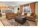 Comfortable living room featuring plush seating, natural light, and an elegant rug at 4820 W 125Th Ave, Broomfield, CO 80020