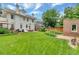 Lush backyard featuring a stone patio, lawn, and privacy fence at 4045 E 18Th Ave, Denver, CO 80220