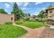 Expansive backyard featuring lush green lawn, garden, and stone path at 4045 E 18Th Ave, Denver, CO 80220