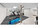 Basement with exercise equipment and white painted brick at 4045 E 18Th Ave, Denver, CO 80220