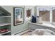 Bedroom with window seat, books, framed art, and accent pillows with a shag carpet to add a bit of luxury at 4045 E 18Th Ave, Denver, CO 80220
