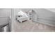 Large bedroom with light-colored carpet, lots of light, and adjacent bathroom at 4045 E 18Th Ave, Denver, CO 80220