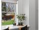 Sunlit breakfast nook with charming window view and coffee setup at 4045 E 18Th Ave, Denver, CO 80220