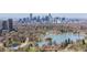 City skyline in the distance with green park in the foreground at 4045 E 18Th Ave, Denver, CO 80220