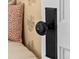 Interior shot of an ornate antique door knob and plate on a white door next to a bed at 4045 E 18Th Ave, Denver, CO 80220