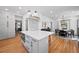 Spacious kitchen island with modern appliances and open layout to dining area at 4045 E 18Th Ave, Denver, CO 80220