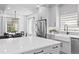 Bright kitchen with white countertops, stainless steel appliances, and an adjacent dining area at 4045 E 18Th Ave, Denver, CO 80220