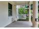 Covered porch with hanging swing and decorative pillows at 4045 E 18Th Ave, Denver, CO 80220