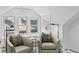 Cozy sitting area with two comfortable armchairs, accent pillows and bright light at 4045 E 18Th Ave, Denver, CO 80220